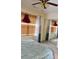 Bedroom featuring a plush bed, mirrored closet doors, and stylish window treatments at 1218 Matt Moore Ct, Lithia Springs, GA 30122