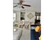 Open-concept dining room with chandelier, contemporary art, and a view into the living room at 1218 Matt Moore Ct, Lithia Springs, GA 30122