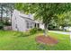 Charming home featuring stone accents, a well-kept lawn, and two-car garage at 1218 Matt Moore Ct, Lithia Springs, GA 30122