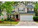 Charming two-story home with stone accents, lush landscaping, and a two-car garage at 1218 Matt Moore Ct, Lithia Springs, GA 30122