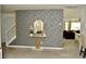 Stylish foyer with a decorated accent wall, modern mirror, and easy access to the living spaces at 1218 Matt Moore Ct, Lithia Springs, GA 30122