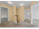 Hallway features neutral carpet and doorways leading to different rooms at 1218 Matt Moore Ct, Lithia Springs, GA 30122