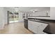 Bright kitchen featuring black appliances with slider access to the backyard at 1218 Matt Moore Ct, Lithia Springs, GA 30122