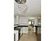 Well-equipped kitchen with stainless steel appliances, modern cabinetry, and seamless flow to the dining area at 1218 Matt Moore Ct, Lithia Springs, GA 30122