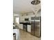 Modern kitchen with stainless steel appliances, sleek countertops, and an efficient layout at 1218 Matt Moore Ct, Lithia Springs, GA 30122