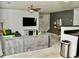 Comfortable living area with a plush sectional, mounted TV, and designer touches at 1218 Matt Moore Ct, Lithia Springs, GA 30122