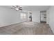Bright living room featuring neutral carpet, fresh paint, and ample natural light at 1218 Matt Moore Ct, Lithia Springs, GA 30122