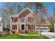 Charming two-story brick home with a well-manicured lawn and a two-car garage at 4271 Weston Sw Dr, Lilburn, GA 30047
