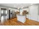 Eat-in kitchen featuring granite countertops, stainless steel appliances, and an island at 4271 Weston Sw Dr, Lilburn, GA 30047