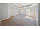 Large main bedroom featuring a tray ceiling, ceiling fan, and ample space at 4271 Weston Sw Dr, Lilburn, GA 30047