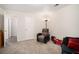 Finished basement featuring plush seating, a red wagon and doorway to another room at 5527 Jerome Rd, College Park, GA 30349
