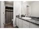 Bathroom featuring modern vanity with marble top and decorative shower curtain at 5527 Jerome Rd, College Park, GA 30349
