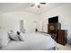 Cozy bedroom featuring neutral carpet, a ceiling fan, and a large closet at 5527 Jerome Rd, College Park, GA 30349