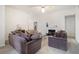 Spacious living room featuring a fireplace and multiple sofas at 5527 Jerome Rd, College Park, GA 30349