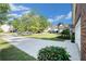 Quiet street view showing manicured lawns and mature trees in a residential neighborhood at 5527 Jerome Rd, College Park, GA 30349