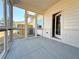 Screened-in back porch with concrete flooring and a view of the private backyard at 1277 Fern Ridge Ct # 22, Norcross, GA 30093