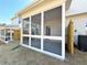 Exterior view of a covered and screened back porch with an open backyard at 1277 Fern Ridge Ct # 22, Norcross, GA 30093