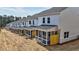 Exterior view of a row of modern townhomes with a covered and screened back porch at 1277 Fern Ridge Ct # 22, Norcross, GA 30093