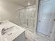 Stylish bathroom with double sinks, modern finishes, and a marble-like walk-in shower at 1277 Fern Ridge Ct # 22, Norcross, GA 30093