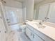 Bright bathroom featuring a tub-shower combo, marbled floors, and a modern vanity at 1277 Fern Ridge Ct # 22, Norcross, GA 30093