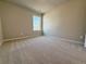 Cozy bedroom with neutral walls and plush carpeting, filled with ample natural light at 1277 Fern Ridge Ct # 22, Norcross, GA 30093