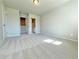 Spacious carpeted bedroom with closet and bathroom entrances providing an en-suite design at 1277 Fern Ridge Ct # 22, Norcross, GA 30093