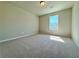 Bedroom with neutral carpeting, a window, and ample natural light at 1277 Fern Ridge Ct # 22, Norcross, GA 30093