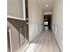 Inviting entryway with hardwood floors, wainscoting, and a view into the living area at 1277 Fern Ridge Ct # 22, Norcross, GA 30093