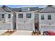 Charming townhome featuring a brick facade, two-car garage, and contemporary design elements at 1277 Fern Ridge Ct # 22, Norcross, GA 30093