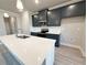 Modern kitchen with quartz countertops, stainless steel appliances, and an island at 1277 Fern Ridge Ct # 22, Norcross, GA 30093