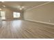 Bright living room featuring hard surface floors, ceiling fan and natural light at 1277 Fern Ridge Ct # 22, Norcross, GA 30093