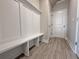 Mudroom features a built-in bench and storage, plus access to the garage at 1277 Fern Ridge Ct # 22, Norcross, GA 30093
