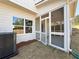 Back porch featuring a screened-in area with ample sunlight, perfect for outdoor lounging at 1277 Fern Ridge Ct # 22, Norcross, GA 30093