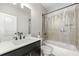 Clean bathroom featuring a shower-tub combo, vanity, and mirror at 1358 Pavilion Se Ct, Atlanta, GA 30316