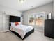 Well-lit bedroom with neutral tones, large window, and modern furniture at 1358 Pavilion Se Ct, Atlanta, GA 30316