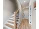 Elegant staircase with modern railing leading to the upper level at 1358 Pavilion Se Ct, Atlanta, GA 30316