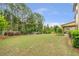Large backyard with a well-manicured lawn and a covered patio, perfect for outdoor activities at 1645 Colleens Cask Ter, Dacula, GA 30019