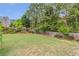 Large, fenced backyard with plenty of room for play, gardening, and outdoor enjoyment at 1645 Colleens Cask Ter, Dacula, GA 30019