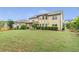 Spacious backyard featuring a covered patio and ample green space for outdoor activities at 1645 Colleens Cask Ter, Dacula, GA 30019