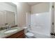 Clean bathroom with granite vanity, shower-tub combo, and neutral color scheme at 1645 Colleens Cask Ter, Dacula, GA 30019