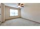 Empty carpeted bedroom with window at 1645 Colleens Cask Ter, Dacula, GA 30019