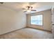 Carpeted bedroom with ceiling fan and closet at 1645 Colleens Cask Ter, Dacula, GA 30019