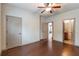 Bedroom features hardwood floors and doors to other rooms in the house at 1645 Colleens Cask Ter, Dacula, GA 30019