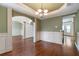 Open-concept dining area with hardwood floors and easy access to other rooms at 1645 Colleens Cask Ter, Dacula, GA 30019