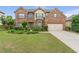 Charming two-story brick home with a well-manicured lawn and inviting curb appeal at 1645 Colleens Cask Ter, Dacula, GA 30019