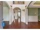 Elegant foyer with hardwood floors, arched doorways, and decorative columns at 1645 Colleens Cask Ter, Dacula, GA 30019