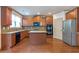 Modern kitchen featuring stainless steel appliances, granite countertops and hardwood floors at 1645 Colleens Cask Ter, Dacula, GA 30019
