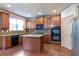 Modern kitchen featuring stainless steel appliances, granite countertops, island and hardwood floors at 1645 Colleens Cask Ter, Dacula, GA 30019