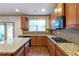 Bright kitchen featuring stainless steel appliances, granite countertops, and hardwood floors at 1645 Colleens Cask Ter, Dacula, GA 30019