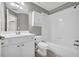 This bathroom features a shower-tub combo and a large, single-sink vanity with white cabinets at 3641 Carriage Glen Way, Dacula, GA 30019